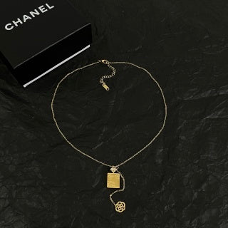 CHANEL Asymmetric Charm Pendant Necklace